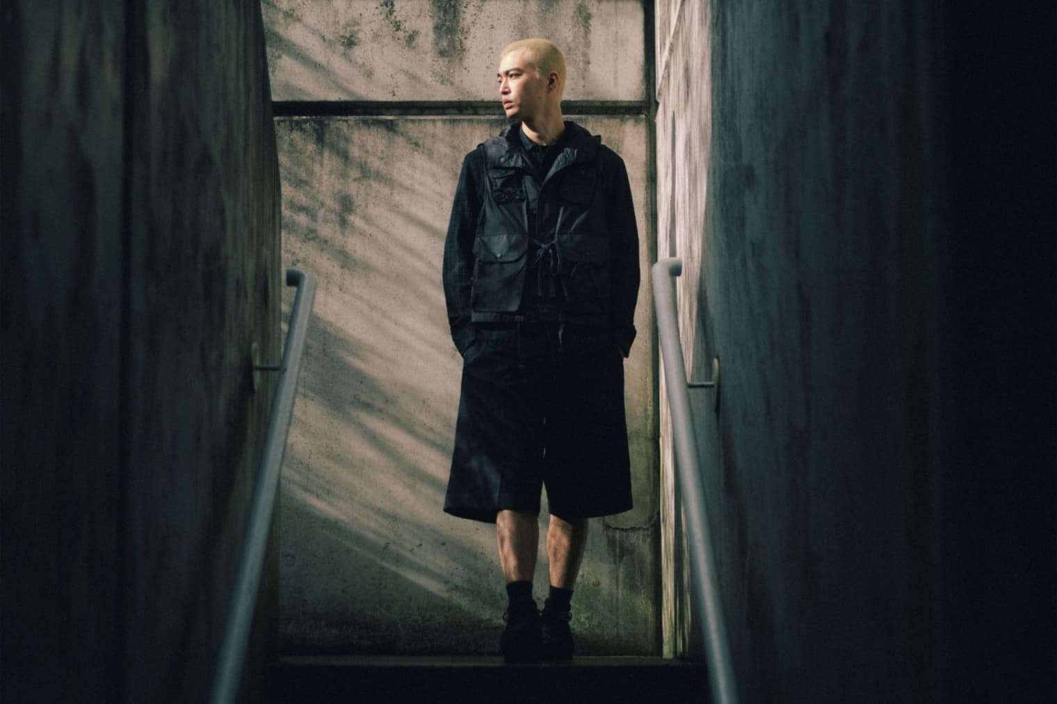 A man wears a black lightweight jacket