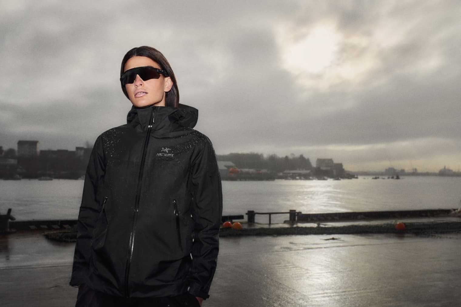 A woman wears a black Arc'teryx jacket