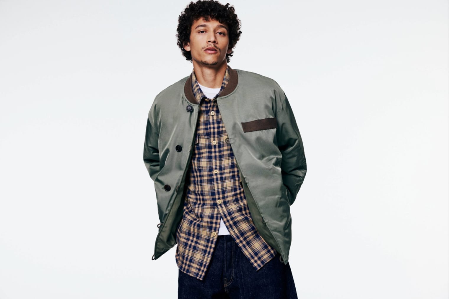A model wears the Visvim Corps Bomber Jacket