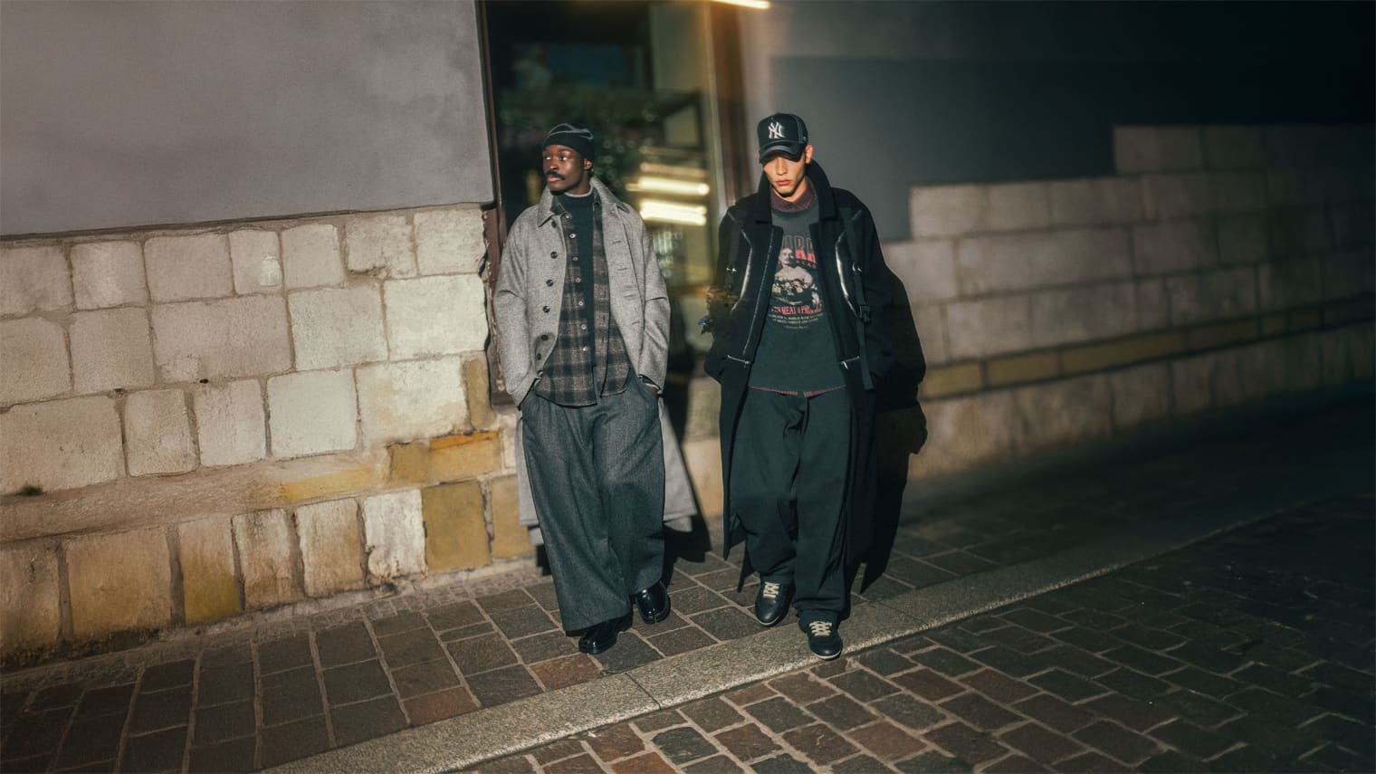 Two men walking wearing Rick Owens coat, Willy Chavarria and 47 NY Cap.