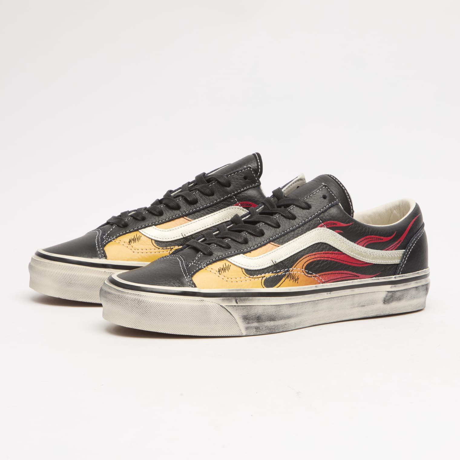 Image of Vans Old Skool sneakers with a flame inspired print
