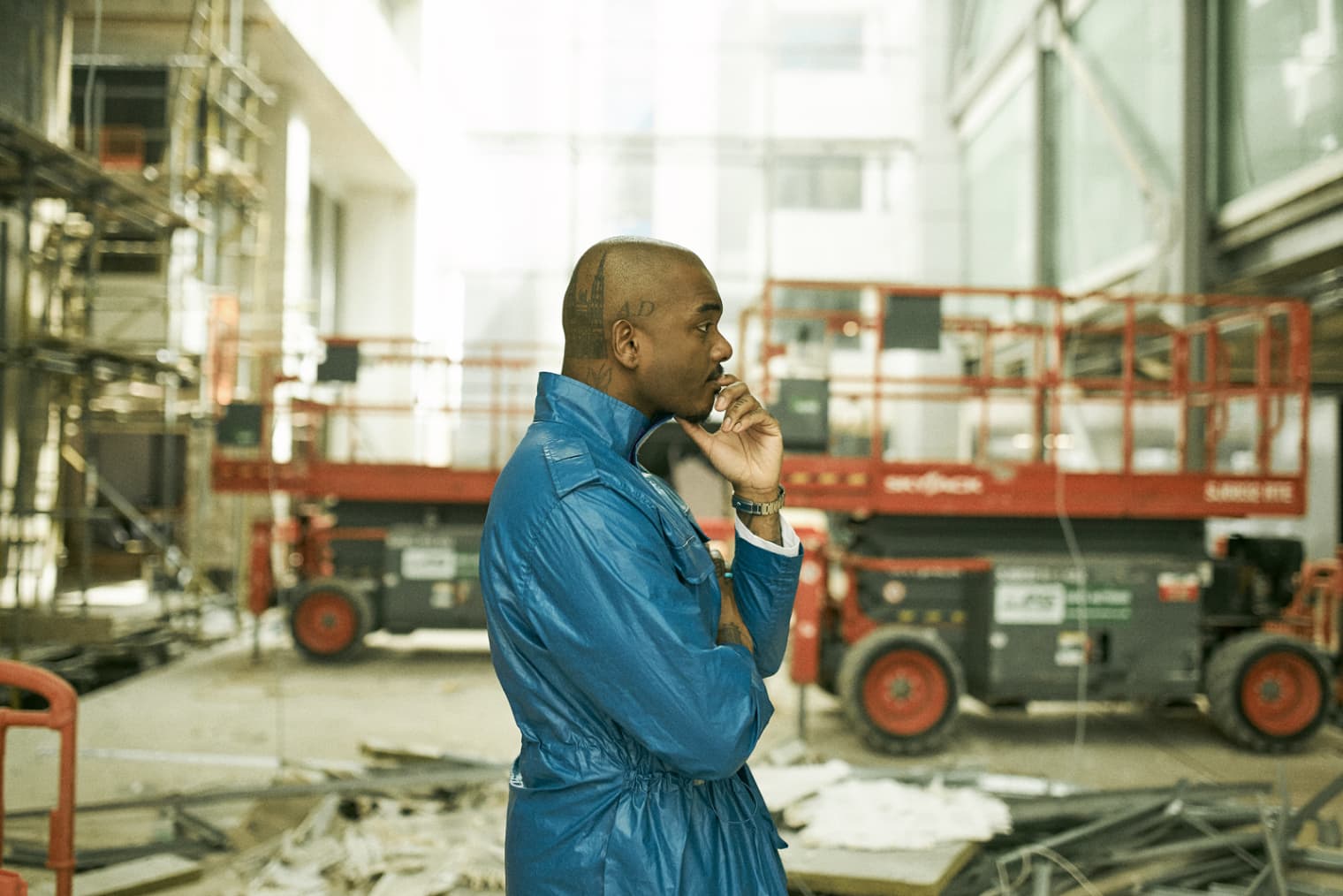 Samuel Ross stands in front of a construction site in London - Building Utopia with A-COLD-WALL*'s Samuel Ross END. 