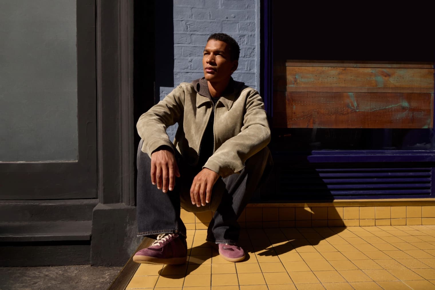A model wears a Rick Owens Brad Shirt in brown suede