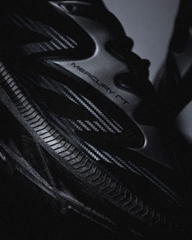 A close up of a black Anima sneaker