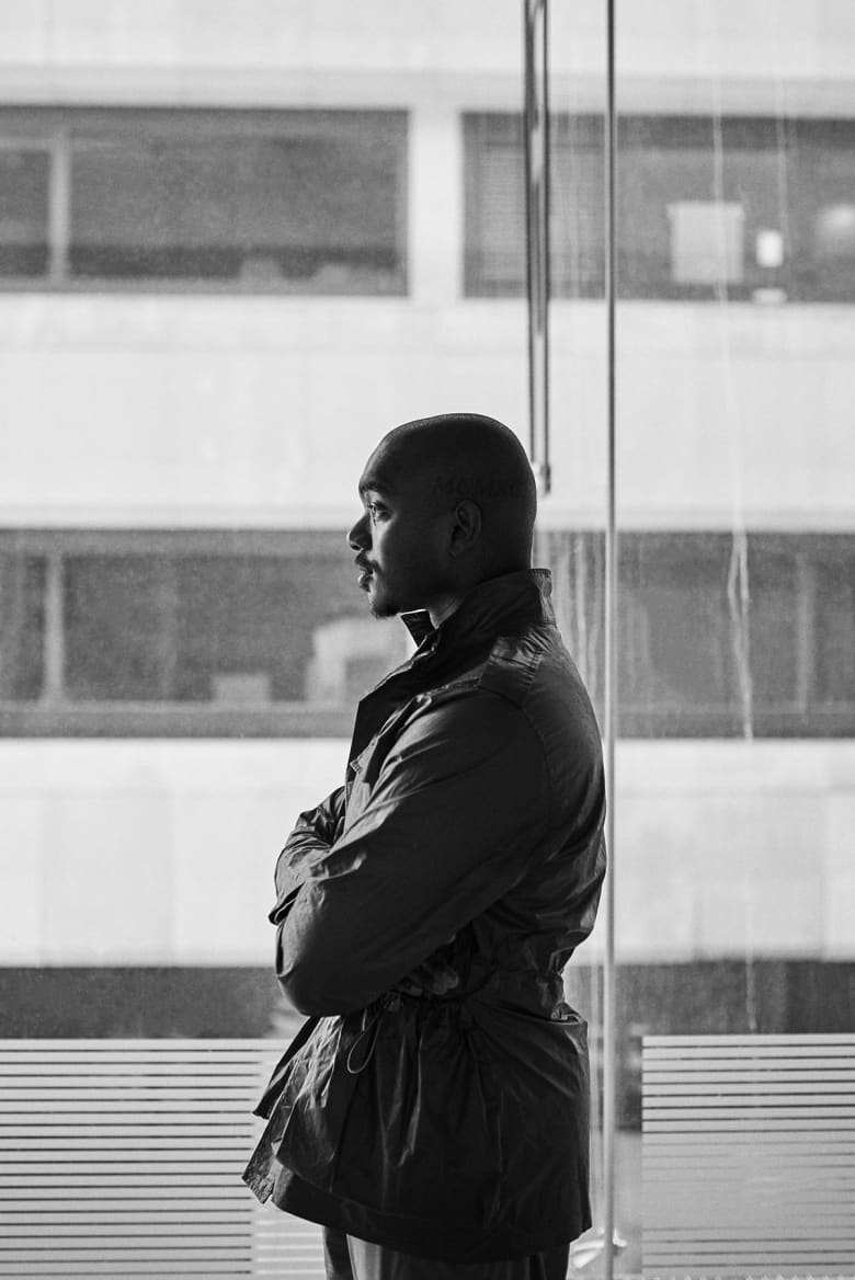 Samuel Ross standing in front of window in London studio - Building Utopia with A-COLD-WALL*'s Samuel Ross END. 