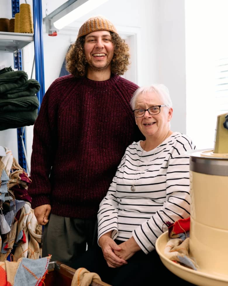 Jojo with a woman who works in the Barbour knitwear factory