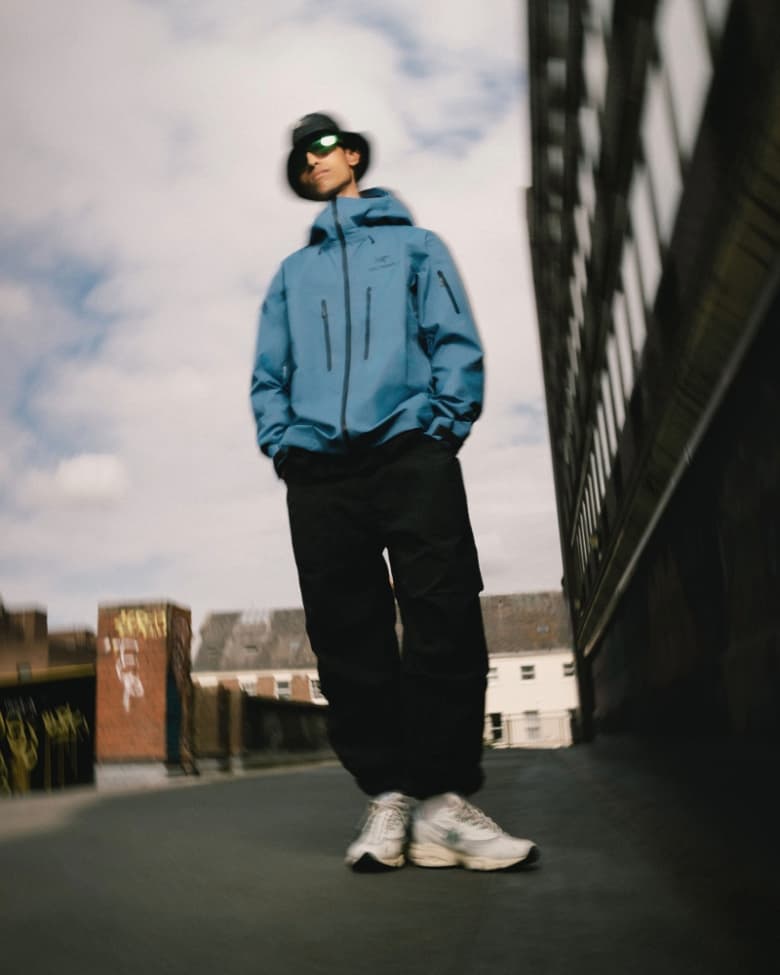 A model wears a blue Arc'teryx jacket
