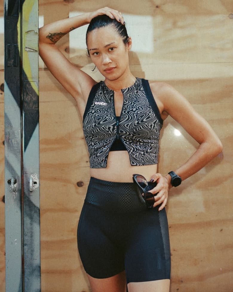 A woman wears a Bandit running vest and shorts