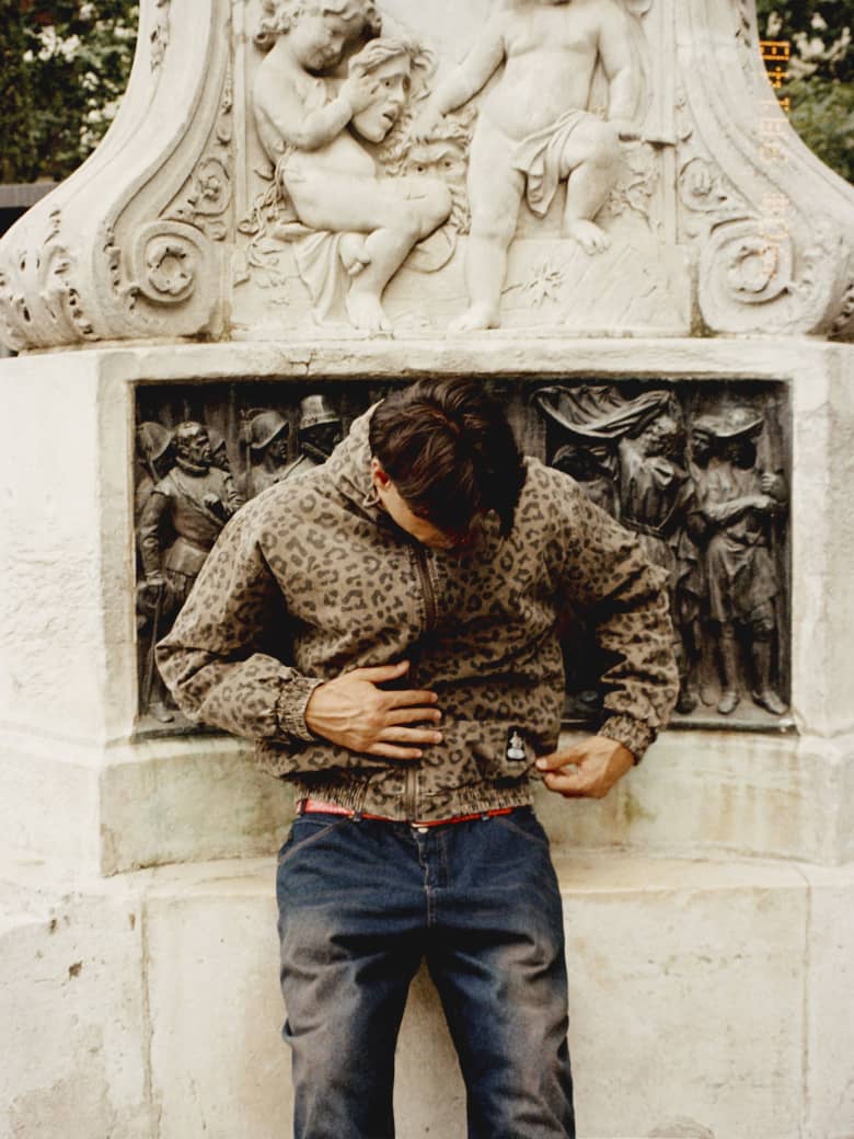 A model wears a Butter Goods zipped work jacket in leopard print