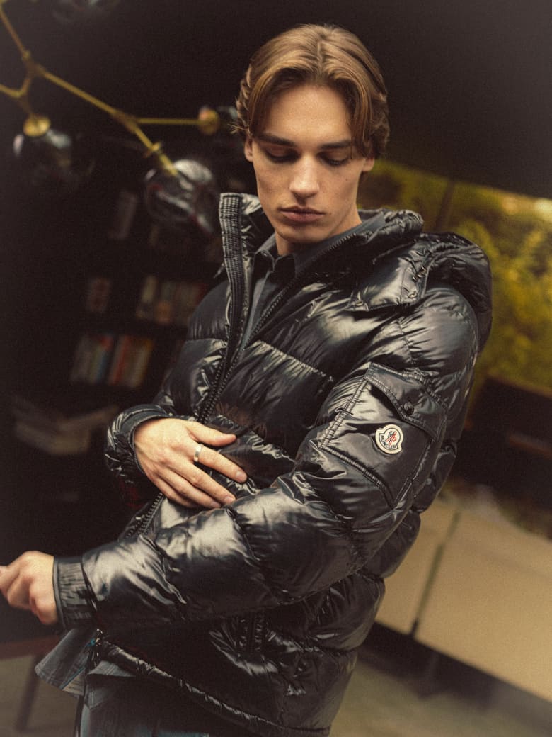 A man wearing the Moncler Couyere Jacket Recycled Micro Rip-Stop Padded Coat in the colour Navy.