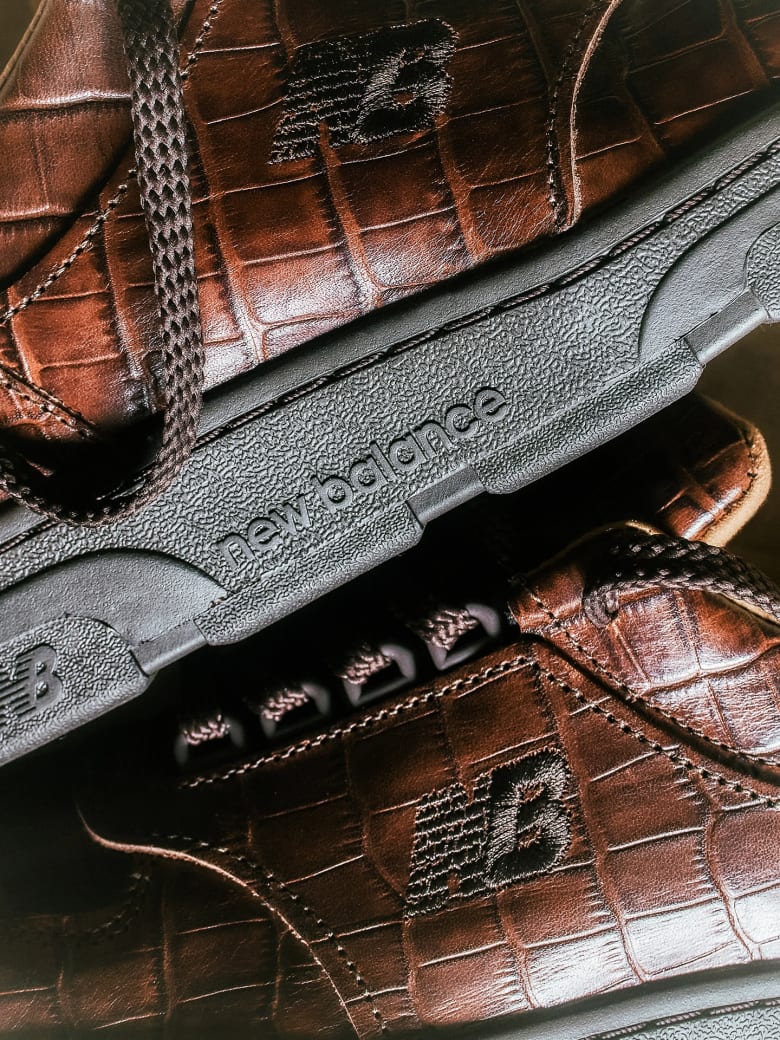 A close up of a pair of brown leather shoes.