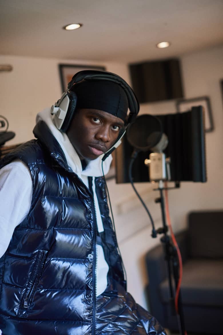 London musician Master Peace recording vocals at his home studio. 