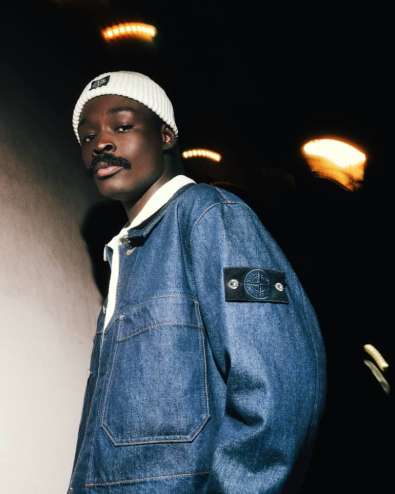 A model wears a Stone Island denim overshirt