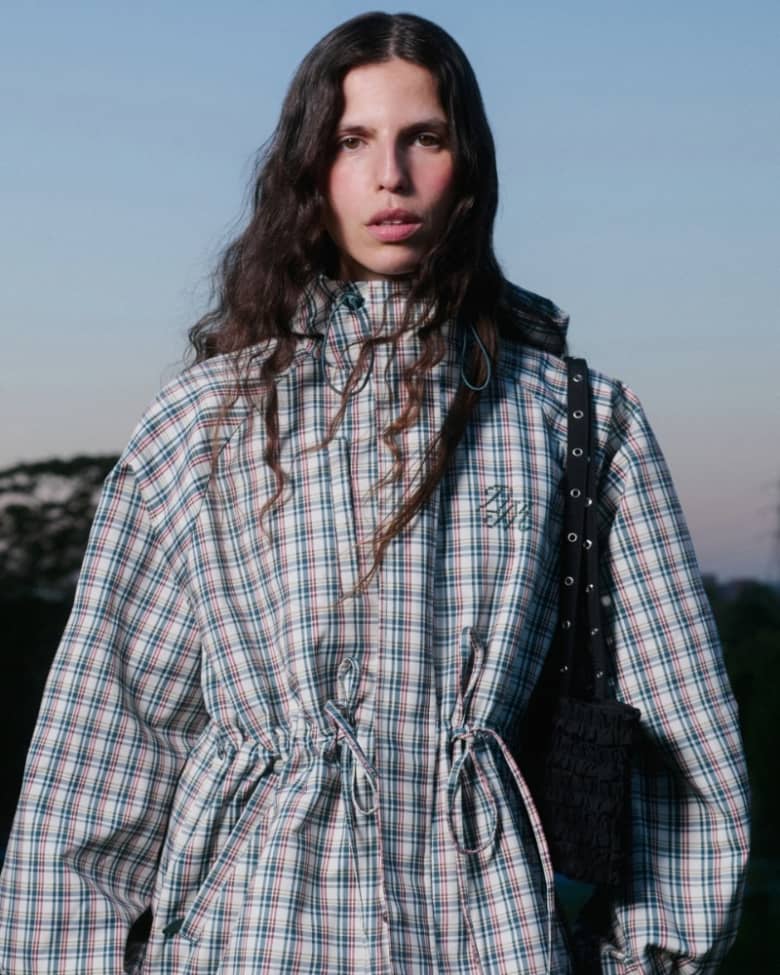 A model wears a Damson Madder jacket