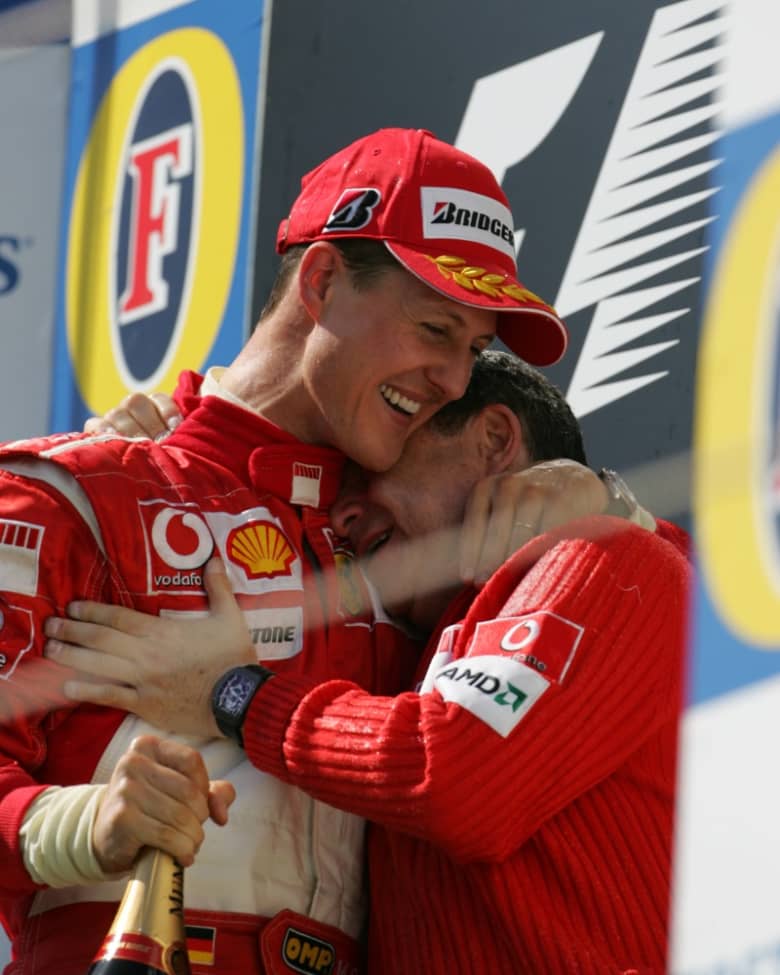 Michael Schumacher celebrates a race win with his Ferrari teammate