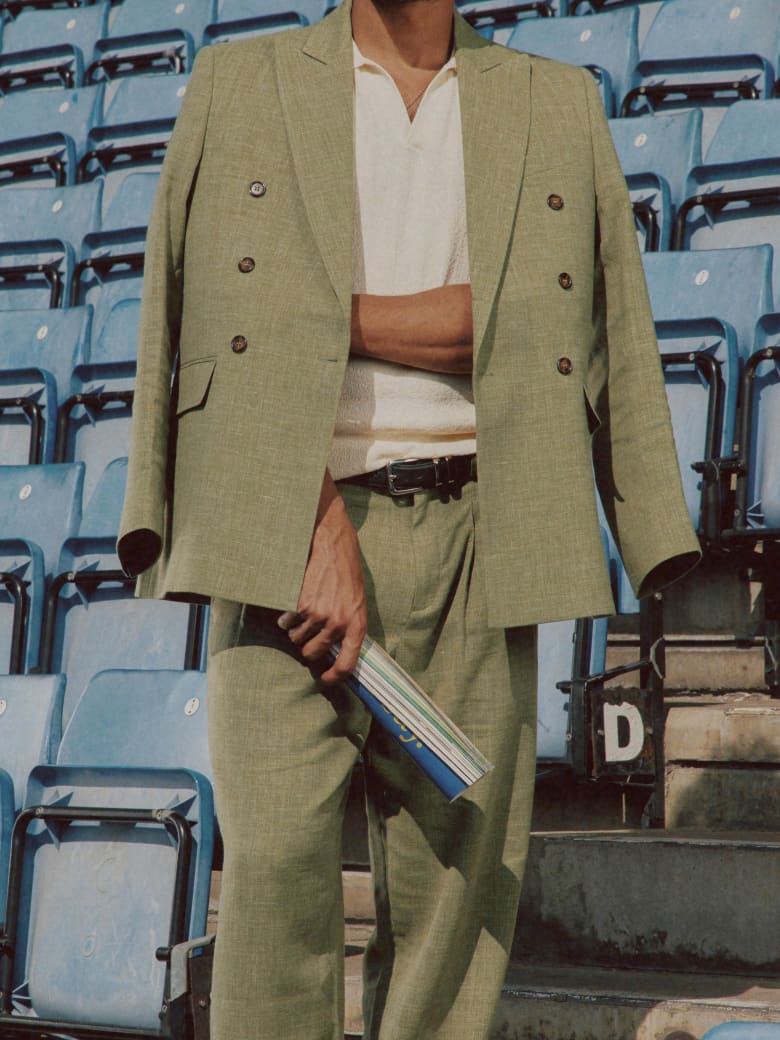 A man wearing the END. x Ronning collection