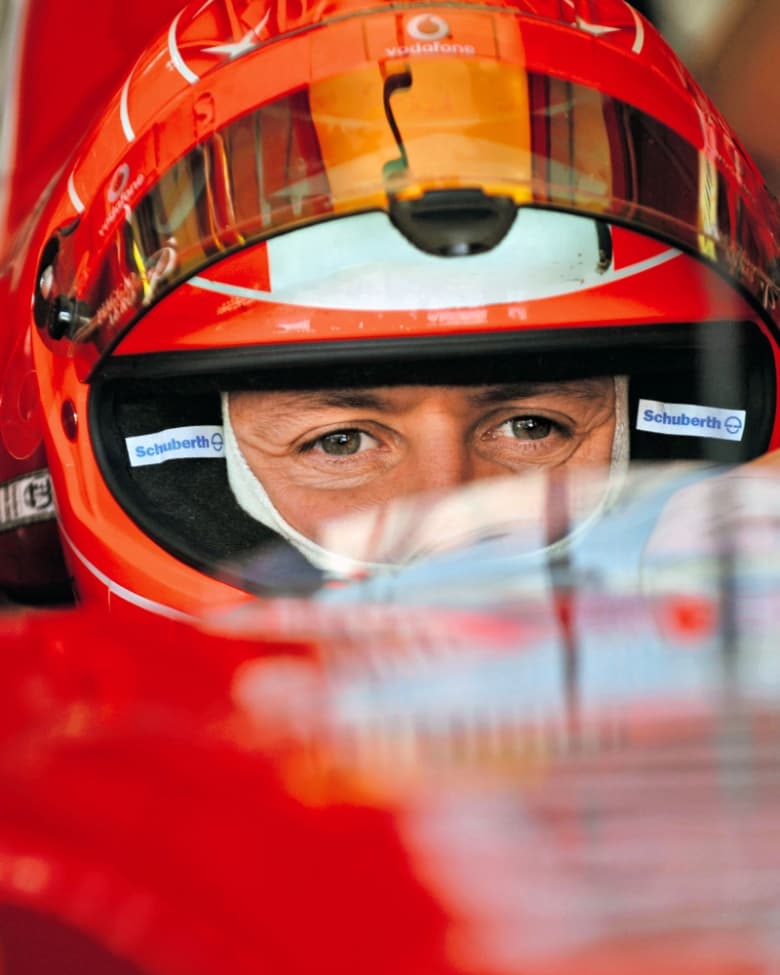 A close-up image of Michael Schumacher while driving