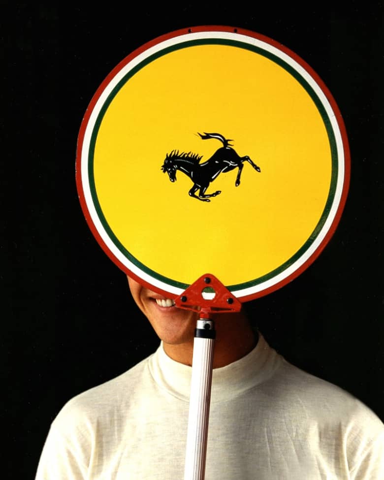 archive imagery shows Michael Schumacher with a Ferrari logo over his face