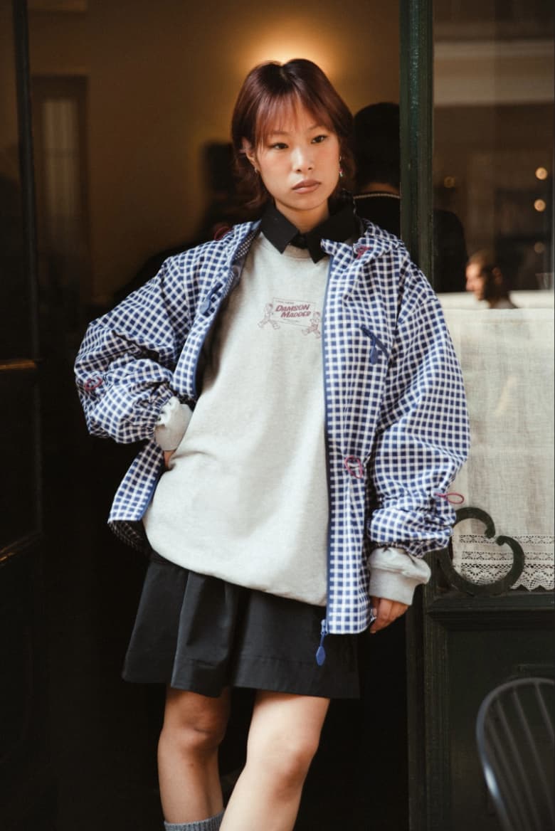 A model wearing the Damson Madder Matilda Jacket in blue gingham