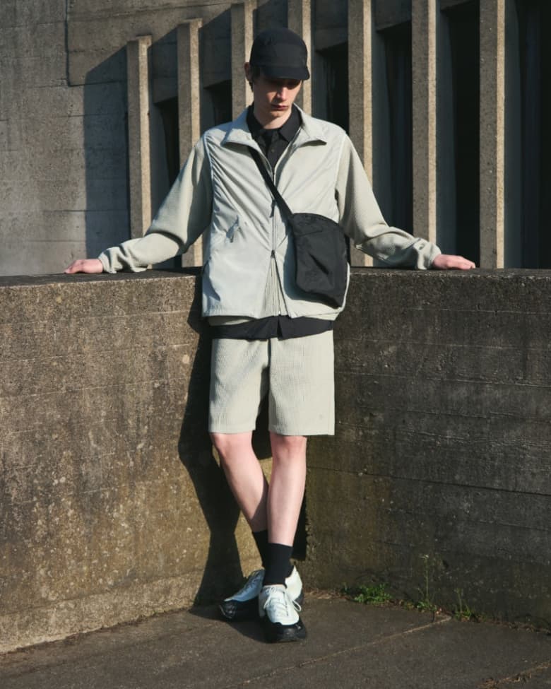 A man wears a technical outfit