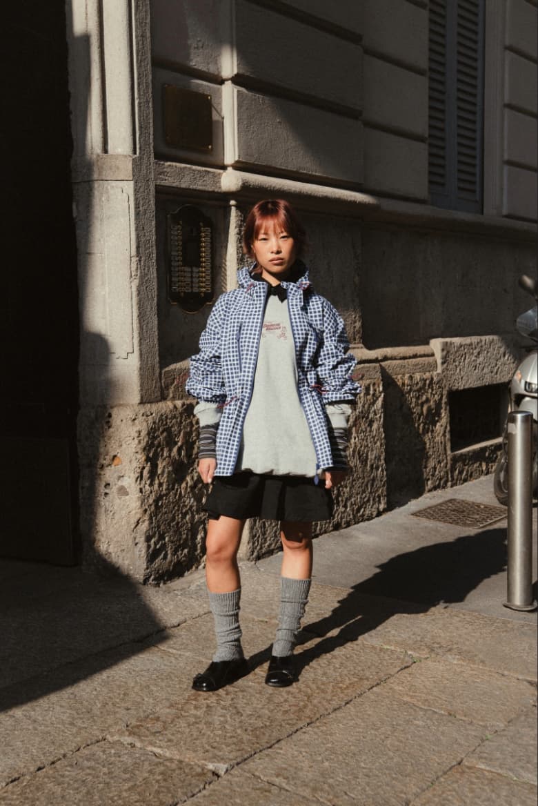 A model wearing the Damson Madder Matilda Jacket in blue gingham