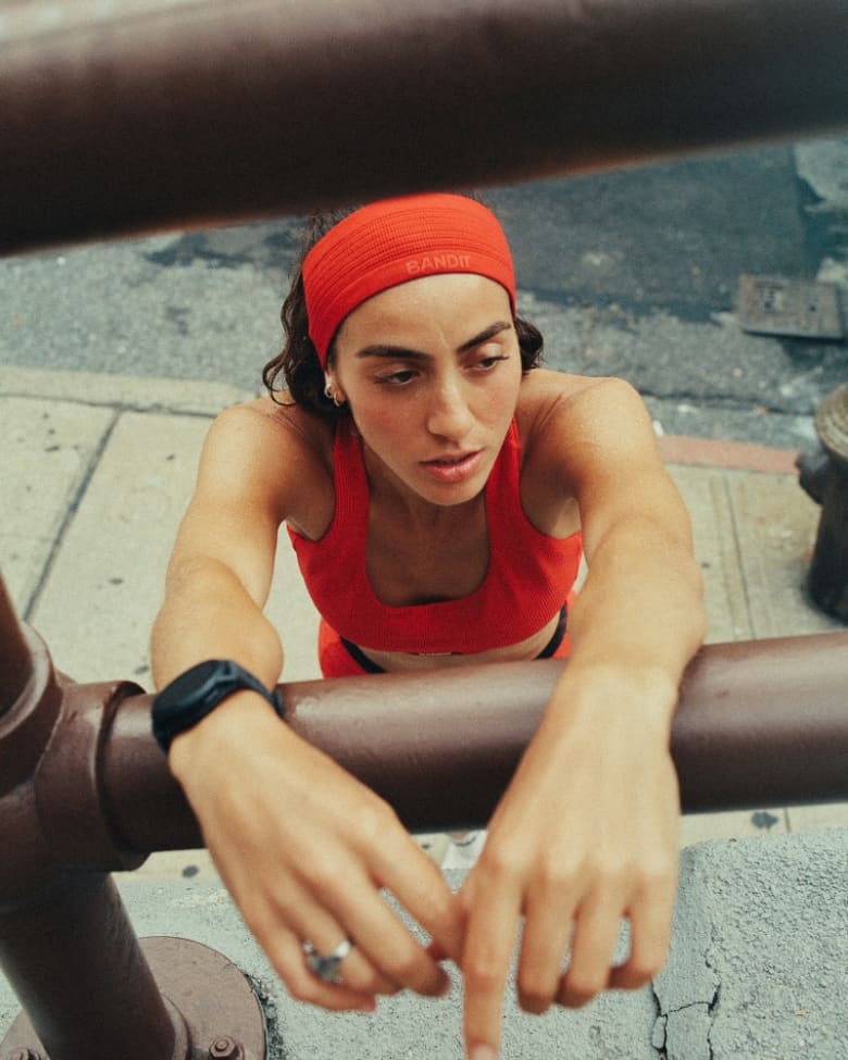 A woman wears a Bandit Running headband
