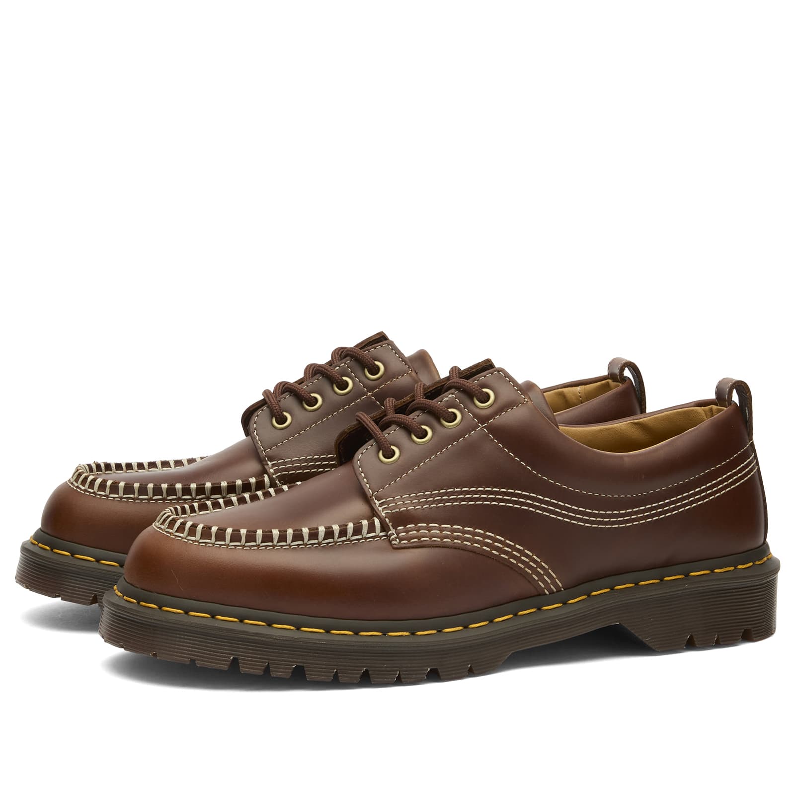 A brown pair of Dr. Martens Lowell Leather Shoes