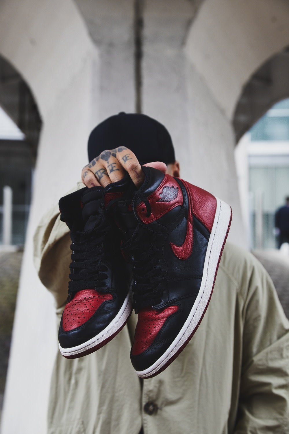 Ste Wing of Visionarism holding Nike Air Jordan 1 Bred 