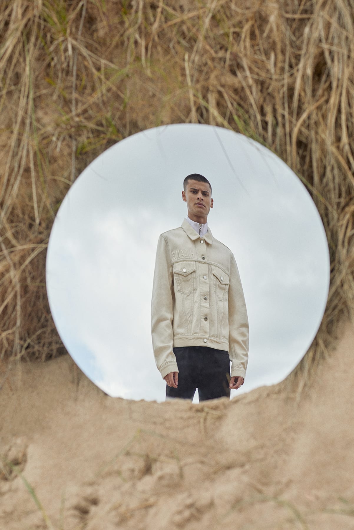 Helmut Lang trucker jacket worn at the beach for Bare Minimum END. editorial