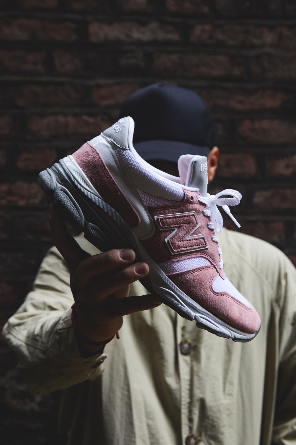 Ste Wing of Visionarism holding pastel pink New Balance 770.9 for END.