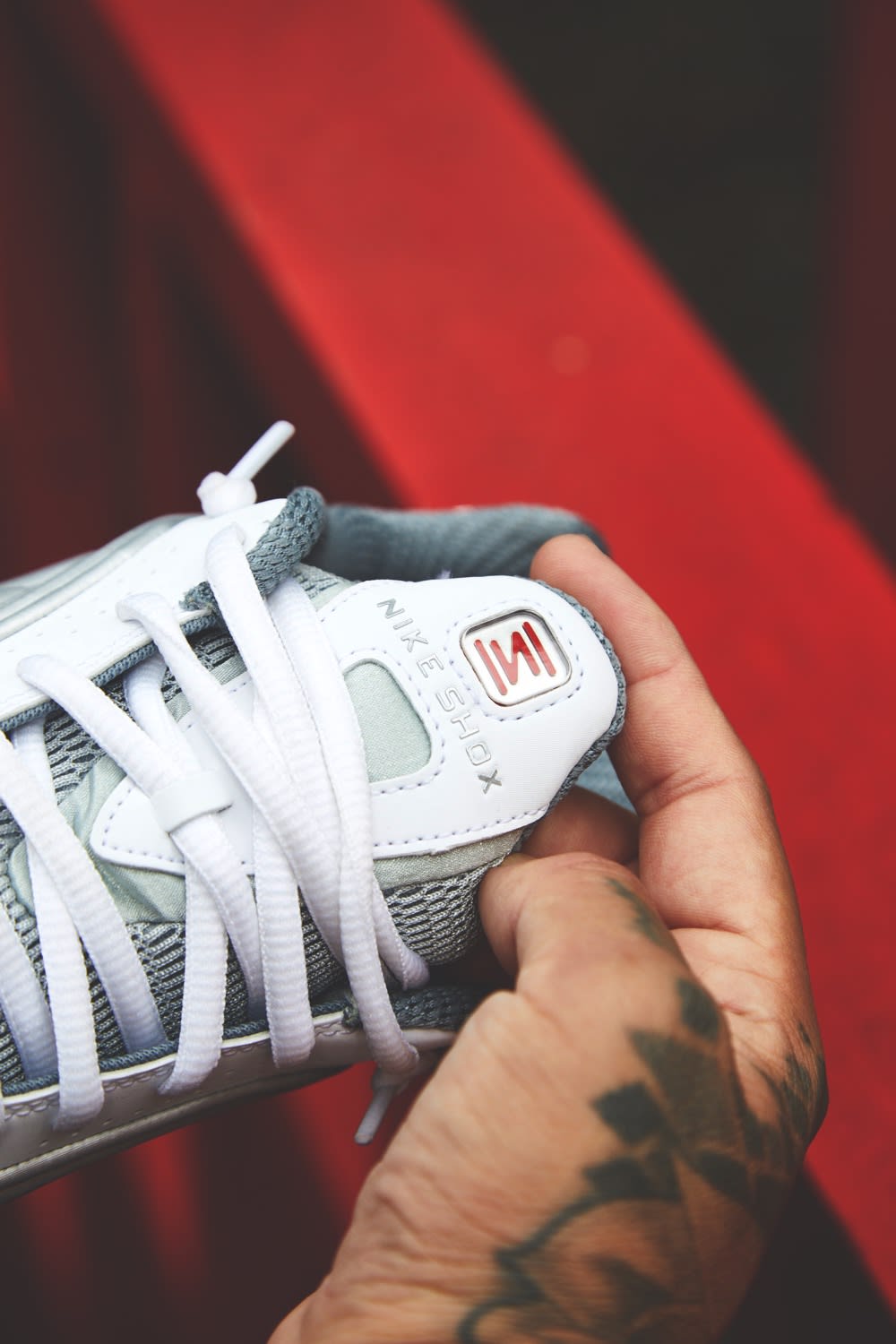 Detail shot of Nike Shox R4 in Metallic Silver by END.