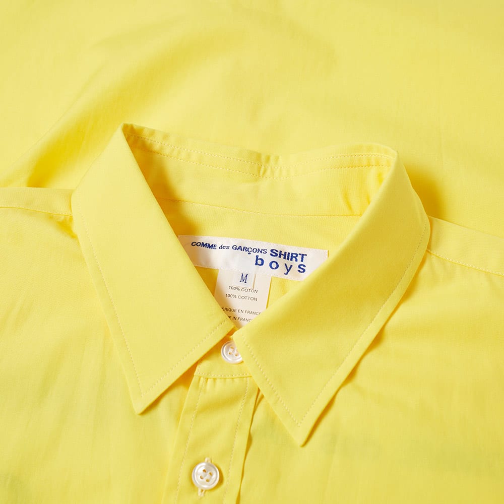 comme des garcons yellow shirt
