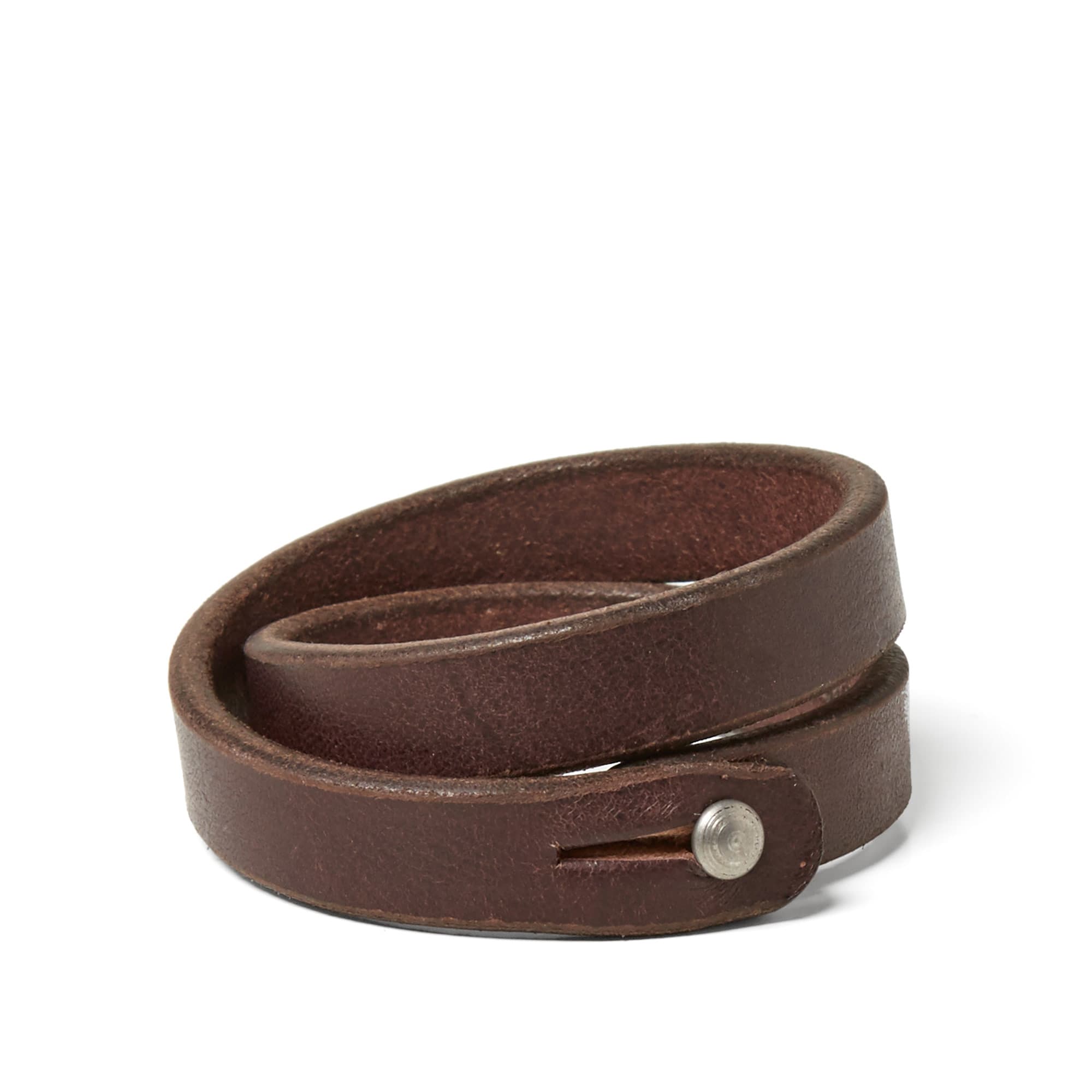 A real favourite here at END., Tanner Goods hand craft all of their goods to their exacting standard in their Portland workshop. Made from the finest English bridle leather, the rounded wristband is vegetable-tanned, fastened with a clean stainless steel stud. Each wristband is punched out of a single strip of leather, cut from the densest part of the hide. 

Stainless Steel Stud Fastening
10/11 oz. English Bridle Leather
Hand Made in USA
Vegetable Tanned
Hand Dyed, Waxed and Burnished Edges