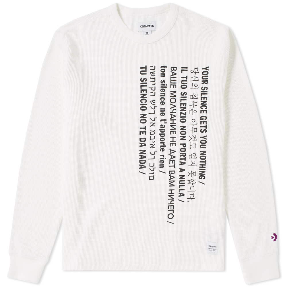 Art-inspired utility, Converse x Slam Jam have designed a Cali Thornhill DeWitt collection. Best known for his work with Kanye West and his typographic sensibility, the Cali DeWitt mantra - “Your Silence Gets You Nothing” – takes centre stage on this thermal tee. Long sleeved, crafted from a heavy-weight cotton and waffle patterned, this tee takes military off the battlefield and onto the streets.

100% Cotton
Heavy Waffle Pattern
“Your Silence Gets You Nothing” Print
Star Chevron Logo