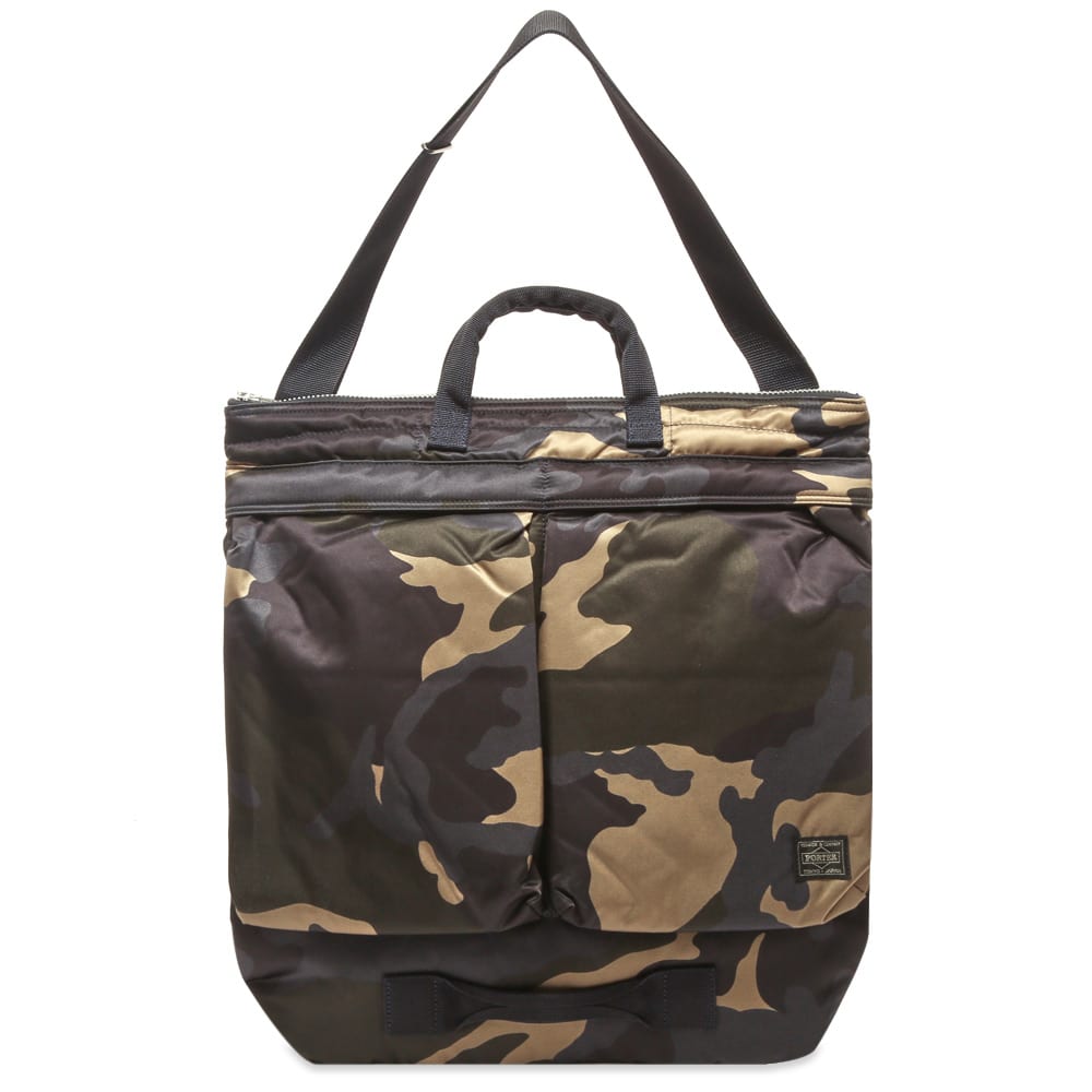 Both functional and stylish, Porter-Yoshida & Co.’s ‘Counter Shade Helmet’ tote shows off a nylon twill construction that’s perfect for carrying heavier loads. Fitted with an interior laptop pocket for the modern man on the go, the camouflage tote has two exterior pockets and a zipped main compartment for securely storing your valuables.

100% Nylon
Laptop Compartment
Main Zip Compartment
2 Front Pockets
Woven Brand Patch
Adjustable Shoulder Strap
Carry Handle
