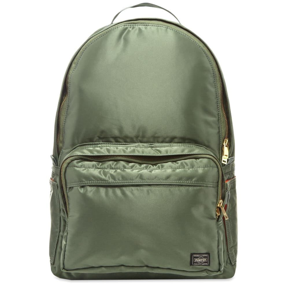 Imbued with Porter-Yoshida & Co.’s durable and style conscious design DNA, this sage green day pack has been cut in a trusty nylon construction. Secured with gold-tone zippers, the portable bag has plenty of handy compartments and is lined with a bold safety orange interior.

100% Nylon
Main Zip Compartment 
2 Front Zip Pockets 
Woven Brand Patch 
Carry Handle 
Adjustable Shoulder Straps