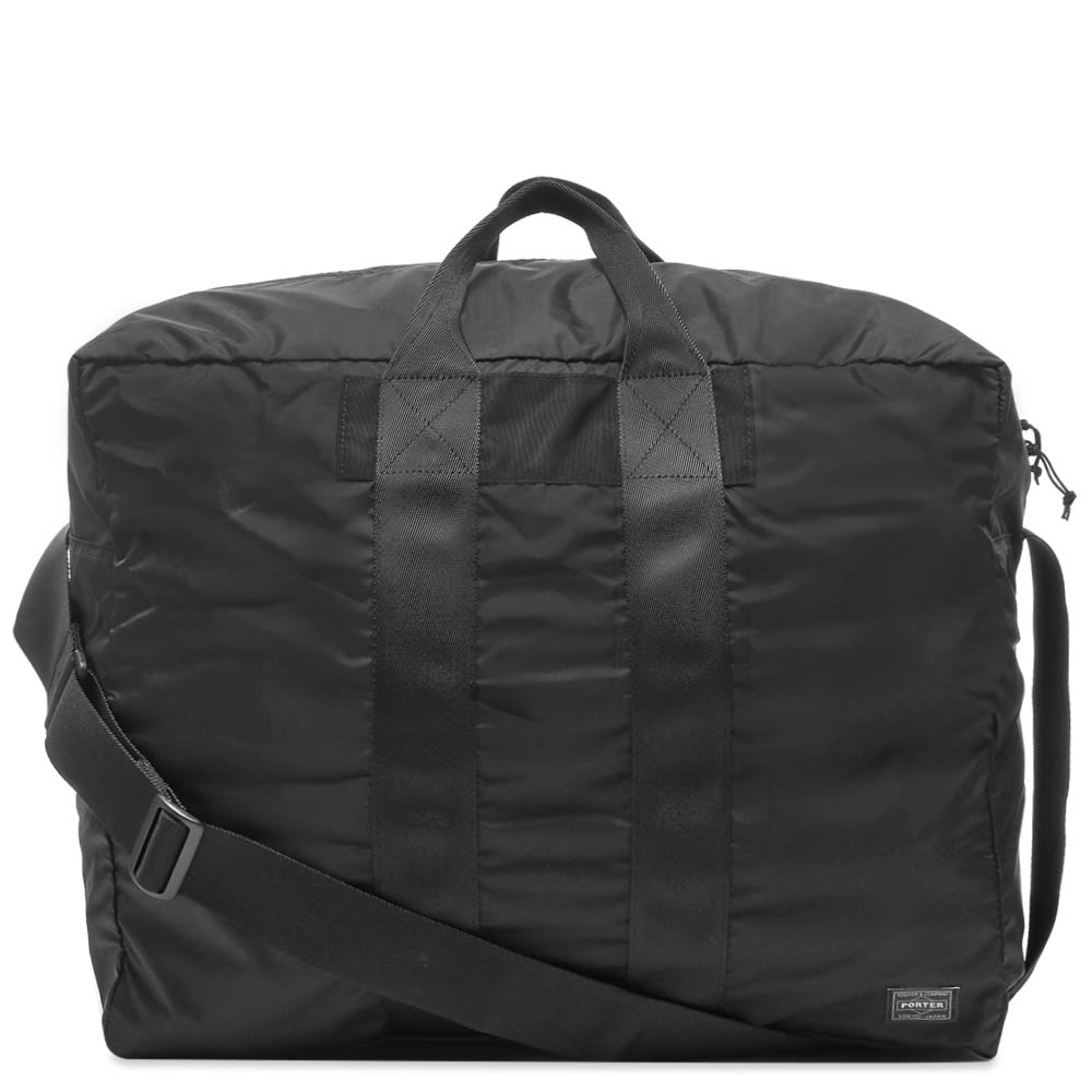 Pack away your weekend essentials and head off with this all-black duffel bag from Porter-Yoshida & Co. in tow. Equipped with a spacious central compartment, the durable Japanese-made nylon accessory has a trio of carry handles and is signed off with a woven brand patch.

100% Nylon
Main Zip Compartment 
Woven Brand Patch 
Carry Handles 
Adjustable Shoulder Strap
Made in Japan