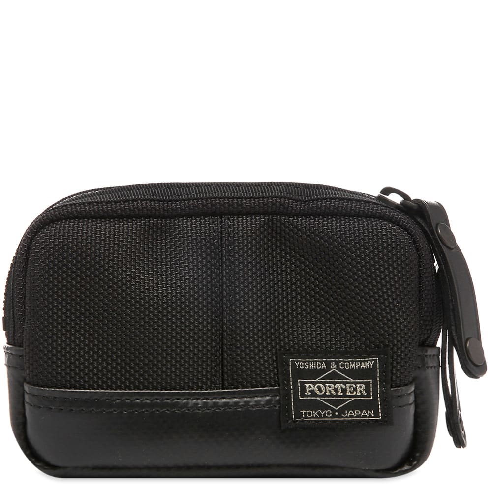 Backed by Japanese brand Porter-Yoshida & Co.’s expertise in the field of stylish accessories, this portable black pouch has been crafted in Japan from durable nylon canvas. Secured with a two-way zipper, the reinforced case has been signed off with an approving woven brand patch.

100% Nylon
2-Way Zip Closure
Carabiner Clasp
Woven Brand Patch 
Reinforced Base
Made in Japan