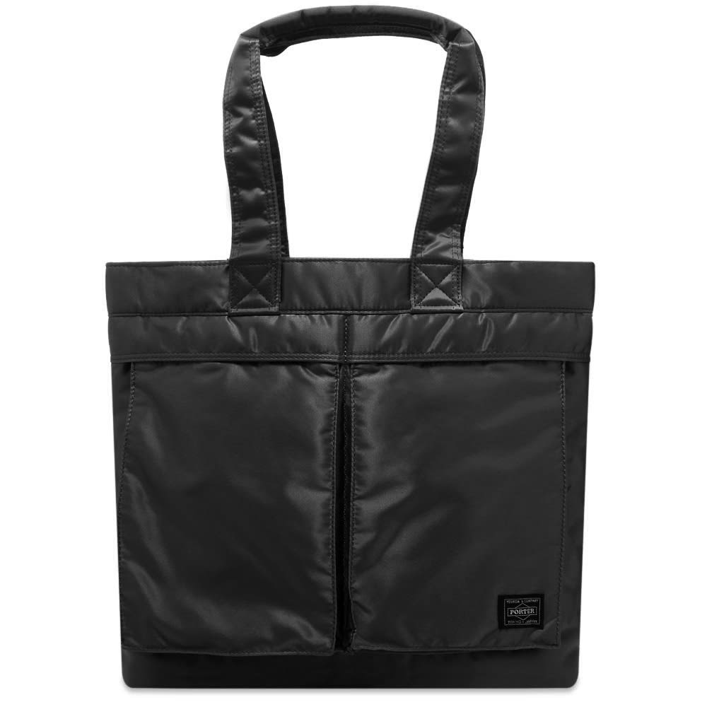 Carrying Porter-Yoshida & Co.’s iconic utilitarian aesthetic through into the new season, this portable tote bag is sure to bring an element of Tokyo cool into your day-to-day rotation. Made in Japan, the durable nylon bag has a pair of functional carry handles and one of its two practical front pockets is topped with a signature logo patch.

100% Nylon
2 Front Pockets
Woven Brand Patch 
2 Carry Handles
Made in Japan