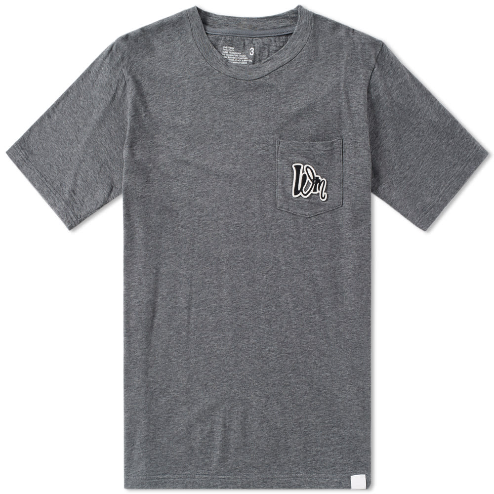 White Mountaineering have a reputation for creating superior outdoor clothing with a distinctive streetwear edge, expertly made to the highest possible level. Adhering to the brand’s core principles: design, utility and technology, the Pocket Tee boasts premium cotton construction, cut with a ribbed crew neck and finished with a patch pocket to the chest with complementary ‘WM’ printed logo for an effortless take on an everyday staple. 

100% Cotton
High Quality Chest Print
Single Chest Pocket
Ribbed Crew Neck
Made in Japan