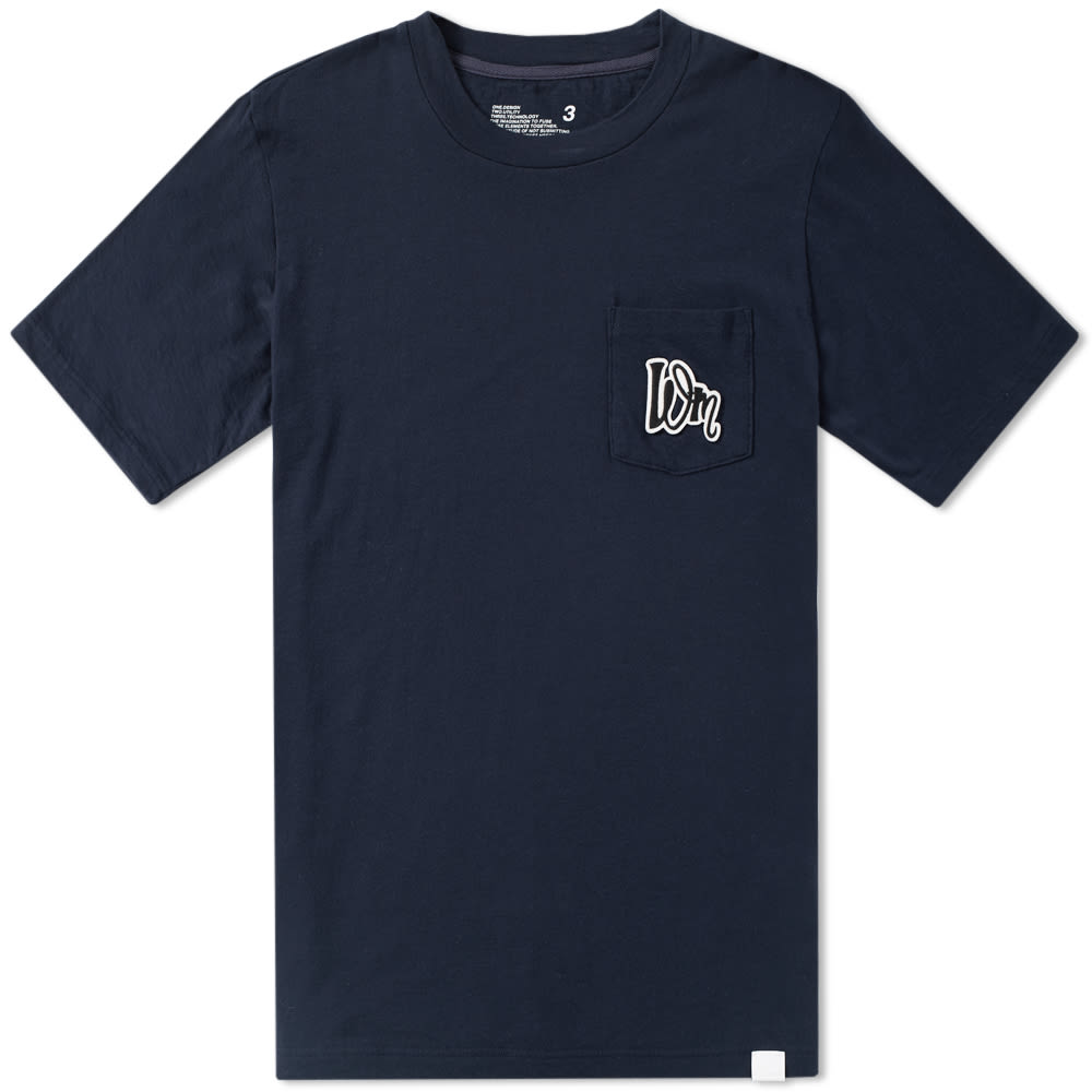White Mountaineering have a reputation for creating superior outdoor clothing with a distinctive streetwear edge, expertly made to the highest possible level. Adhering to the brand’s core principles: design, utility and technology, the Pocket Tee boasts premium cotton construction, cut with a ribbed crew neck and finished with a patch pocket to the chest with complementary ‘WM’ printed logo for an effortless take on an everyday staple. 

100% Cotton
High Quality Chest Print
Single Chest Pocket
Ribbed Crew Neck
Made in Japan