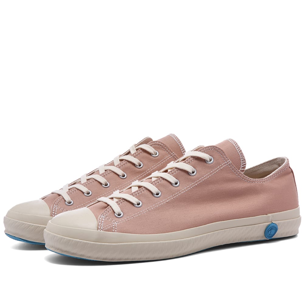 Carried out by a handful of skilled manufacturers and named 'ka-ryu' in Japanese, Shoes Like Pottery’s manufacturing process involves each pair of shoes being kiln-fired, giving their rubber soles a uniquely flexible and highly durable finish. Hand stitched in Japan, this pink canvas pair are finished off with a wax stamp style sole decal depicting the 'Uchide no kozuchi', a magic mallet that is steeped in traditional mythology.

Canvas Uppers
Rubber Toe Cap
Rubberised Brand Stamp 
Vulcanised Rubber Outsole 
Made in Japan