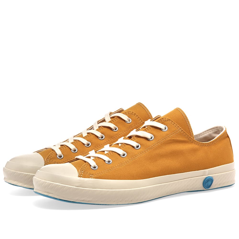 Inspired by tried and tested manufacturing methods, Shoes Like Pottery utilises a unique vulcanising process when crafting its canvas sneakers. Carried out by a handful of skilled manufacturers and named 'ka-ryu' in Japanese, this process involves each pair of shoes being kiln-fired, giving their rubber soles a uniquely flexible and highly durable finish. Hand stitched in Japan, this yellow canvas pair are finished off with the brand's iconic wax detail.

Canvas Uppers
Rubber Toe Cap
Rubberised Brand Stamp 
Vulcanised Rubber Outsole 
Made in Japan