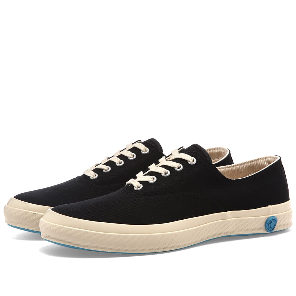 Built with rubber soles that have a uniquely flexible and highly durable finish, this canvas pair of 03JP’s from Shoes Like Pottery have been kiln fired and hand stitched in Japan. Simple and timeless, the black sneakers are finished off with a signature wax emblem – the label's mark of quality and distinction. 
 
Canvas Uppers 
Rubberised Brand Stamp 
Vulcanised Rubber Outsole 
Made in Japan