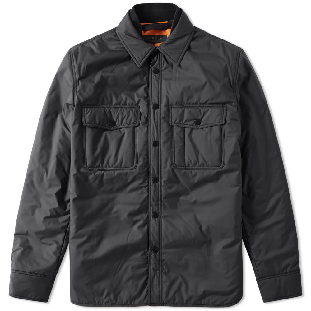 Bridging the gap between outerwear and everyday apparel, rag & bone's Point Shirt features a 650-fill power down insulation to its lining, ensuring an incredibly warming layer without adding any additional bulk to the silhouette. The shirt's shell has been built from a water-repellent polyester, with the front trimmed with branded brass press studs and a western-style pocket to either side.

100% Polyester
Water Repellent Finish
650 Fill Power Down Insulation
Press Stud Closure
Chest Pockets
Contrast Lining
Press Stud Cuffs