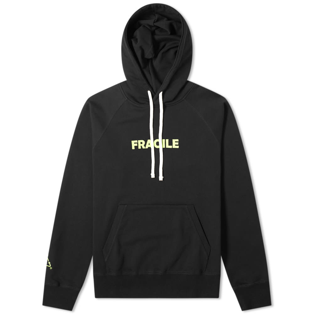 Coming together once again, End. and Wood Wood introduce this ‘Fragile’ capsule, inspired by the distinctive aesthetic values of parcel packaging. Cultivating a specific look seen on industrial tape, shipping labels and caution notices, this collection celebrates the long-term relationship between the British retailer and the Danish streetwear label. This Fred hoody, realised in black loopback jersey, embodies the street-ready cool for which the Danish brand is most highly regarded – teaming comfortable ribbed trims with a drawstring hood and throwing in a kangaroo pouch pocket for good measure. Accompanying the usual accoutrements, high-vis green covers the packaging-themed branding throughout. Wearing ‘FRAGILE’ across the chest, the END. logo – reimagined to replicate the infamous recycling emblem – sits to the cuff and joins a woven tab to ensure the British retailer’s identity stays clear through transit. To complete the overarching aesthetic, the hoody comes packaged in a bespoke pouch with the capsule’s signature tape securing the final twist.100% CottonLoopback JerseyDrawstring HoodRaglan SleevesEmbroidered & Printed BrandingKangaroo Pouch PocketWoven Brand TabRibbed Cuffs & Hem