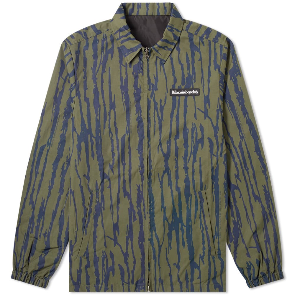 Two faced in all the right ways, this reversible coach jacket from Billionaire Boys Club is a statement piece that’s fuelled by the aesthetic vision of the brand’s founders Pharrell Williams and Nigo. Accented with a rubberised brand patch to its chest, the graphic outer layer is completed with elasticated edging at each sleeve cuff. 
 
100% Nylon
Reversible 
Zip Closure
Rubberised Brand Patch 
2 Front Welt Pockets 
Elasticated Cuffs
