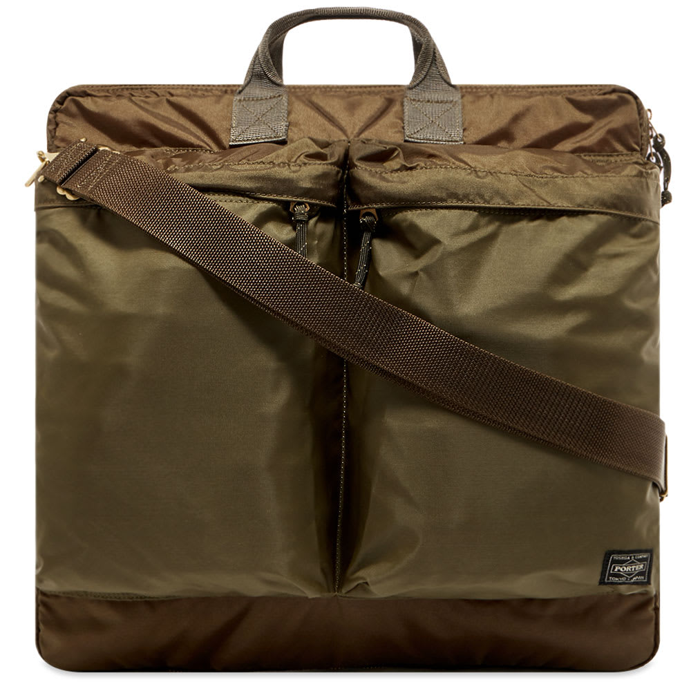 Sporting a distinctive utilitarian aesthetic, Porter-Yoshida & Co.’s Helmet bag is equipped to meet the demands of everyday life. Highly durable, the nylon accessory is designed with easy access in mind, boasting two zipped pockets to the front. Concealed within the interior, a detachable pouch offers an alternative to carrying your smaller essentials.  
 
100% Nylon 
Main Zip Compartment  
2 Zip Pockets 
2 Interior Pockets 
Detachable Pouch  
Woven Brand Patch 
Carry Handles 
Adjustable Shoulder Strap 
Made in Japan
