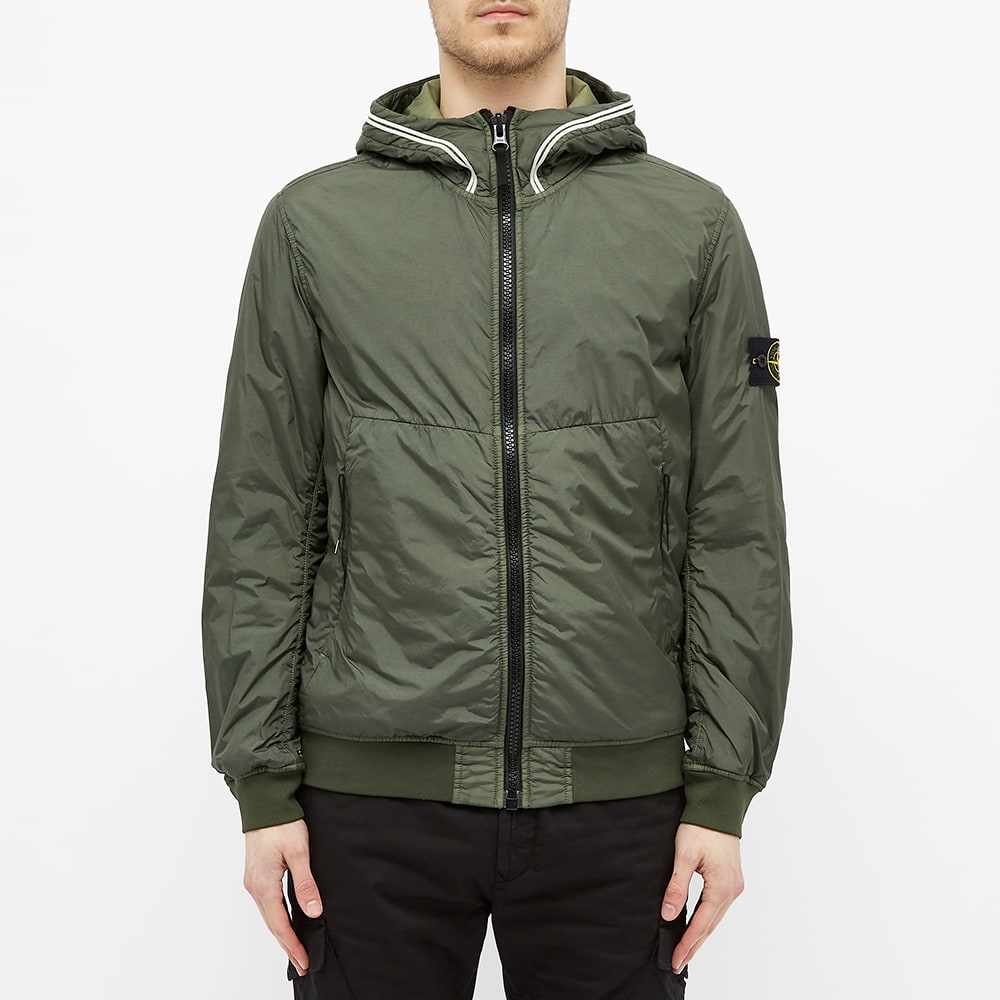 Stone Island Crinkle Reps Primaloft Hooded Jacket Dark Green | END ...