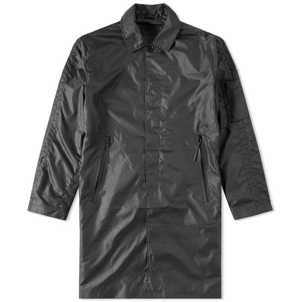MKI's nylon mac features a lightweight ripstop shell, with its design including waterproof zippers throughout to ensure maximum protection from the season's elements. A concealed button closure, utility pocket to sleeve and pockets with waterproof zip closures complete the design.

100% Nylon
Ripstop Construction
Waterproof Zipped Pockets
Concealed Button Closure
Back Vent
Utility Pocket To Sleeve